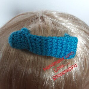 May include: A teal blue crocheted hair clip with a knot on the top. Handmade with love... Shoppygifts.