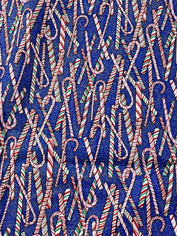 Pink, Red & Green Stripe Candy Cane Fabric on Blue Background with Gold Flecks