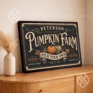 May include: A rectangular framed sign with a black background featuring the text Peterson Pumpkin Farm Est. 2018. The design includes illustrations of two pumpkins, autumn leaves, and the words Pick Your Own, Hayrides, Apple Cider, and Corn Maze.