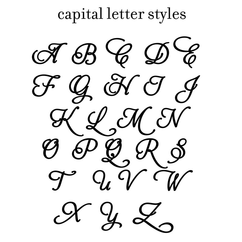 May include: A black and white image of the alphabet in a cursive font style. The letters are written in a flowing, elegant script.