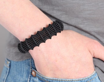 black bracelet for women in parametric jewelry style, a modern cuff bracelet