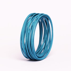 Wide bangle green blue bracelet a gift for women in a contemporary jewelry design petrol grün