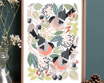 May include: A framed art print featuring three stylized birds with black, gray, and peach-colored plumage. The birds are surrounded by green and gray leaves, berries, and branches, all set against a white background. The frame is made of light brown wood.