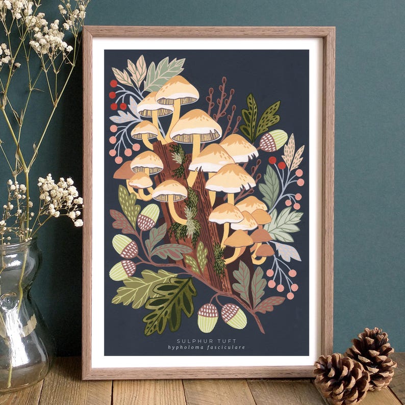 May include: A digital illustration of a cluster of yellow mushrooms growing on a tree trunk. The mushrooms are surrounded by green leaves, acorns, and red berries. The background is a dark blue color. The text "SULPHUR TUFT" and "hypholoma fasciculare" is printed below the image.