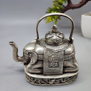 Handcarved white copper elephant teapot, wine pot, tea pot ornaments in Chinese collection, exquisitely decorated, rare in shape, usable