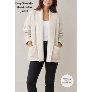 May include: A beige drop shoulder shawl collar jacket with long sleeves and two front pockets. The text on the image reads Drop Shoulder Shawl Collar Jacket and PDF Sewing Pattern Sizes XS - XXL. The jacket is worn over a white top and black pants.