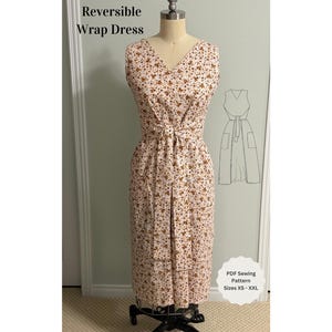Peut inclure: Une robe portefeuille sans manches avec un décolleté en V et une taille nouée, présentant un petit motif floral marron sur fond crème. Le texte Reversible Wrap Dress et PDF Sewing Pattern Sizes XS - XXL sont visibles, avec un croquis de la robe.
