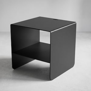 CARINI industrial metal bedside table with minimalist steel frame, internal storage shelf and heavy 4 mm sheet metal construction, designed for modern bedrooms, boutique hotel interiors, loft apartments and contemporary home styling.