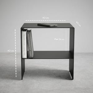 Modern steel bedside table CARINI with open shelf, made from thick 4 mm metal sheet and finished in textured matte black, ideal for industrial bedrooms, minimalist interiors, loft spaces, Japandi rooms and modern home decor projects.