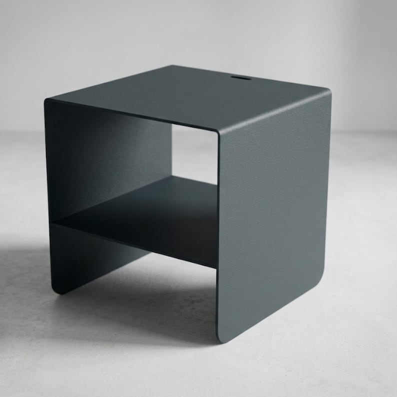 Grey metal nightstand with shelf, handcrafted in Italy from thick steel sheet, featuring a solid 22 kg structure, clean geometric design and modern industrial style, ideal beside a bed, sofa or reading corner in refined interiors