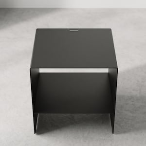 Handmade metal nightstand by Taormina Design, featuring a clean cubic shape, integrated middle shelf and premium powder-coated finish, perfect as a black industrial bedside table, side table or compact storage unit for modern bedrooms