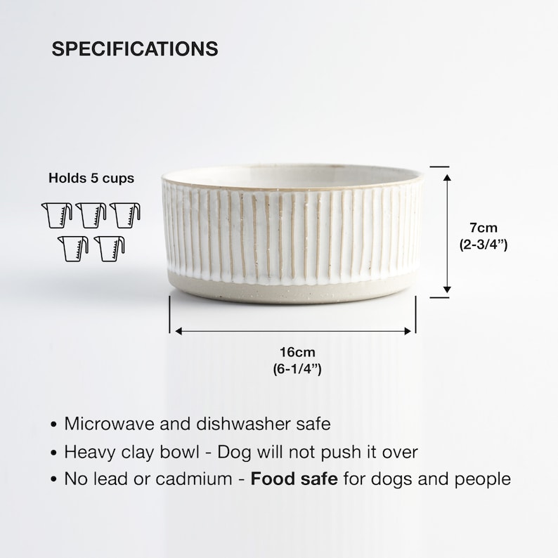 May include: White ceramic pet bowl with a ridged design. It holds 5 cups and is 6-1/4 inches wide and 2-3/4 inches tall. The bowl is microwave and dishwasher safe, made of heavy clay, and is food safe for dogs and people.