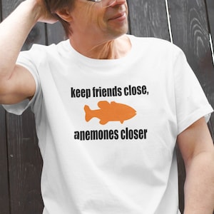 Friends and enemies fish pun unisex T-shirt. Keep friends image 1