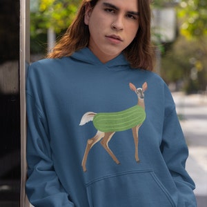 May include: A dark blue hoodie with a graphic of a deer wearing a green cucumber costume.