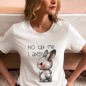 May include: White t-shirt with a cartoon bunny rabbit with an angry expression. The text "NO talk me I angy" is printed on the shirt.