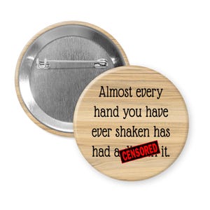 Handshake pinback button