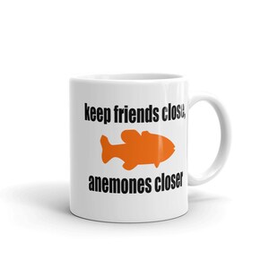 Sea anemone pun mug. Keep friends close, anemones closer. Friends and enemies funny pun dad joke mug. image 3