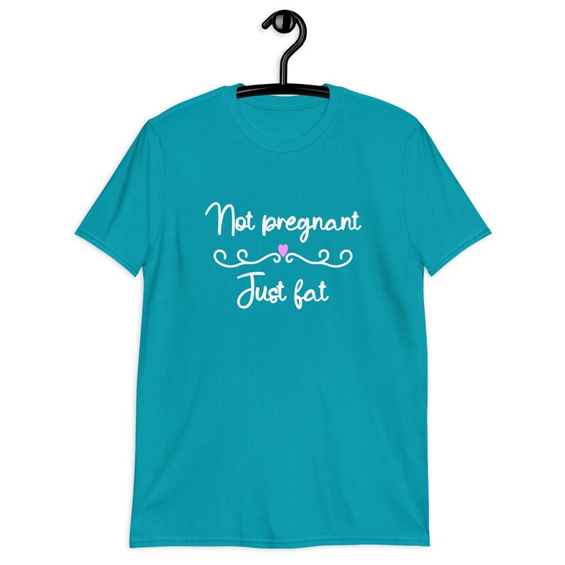 Tropical blue t-shirt with the phrase Not pregnant just fat printed on the front with a small pink heart.