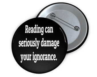 Reading can seriously damage your ignorance pinback button