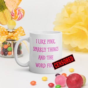 I like pink, sparkly things and the F word funny profanity mug.