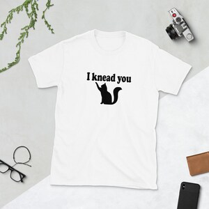 Cat pun T-shirt. I knead you kneading cat short sleeve graphic tee. Kitty biscuits animal pun shirt. White