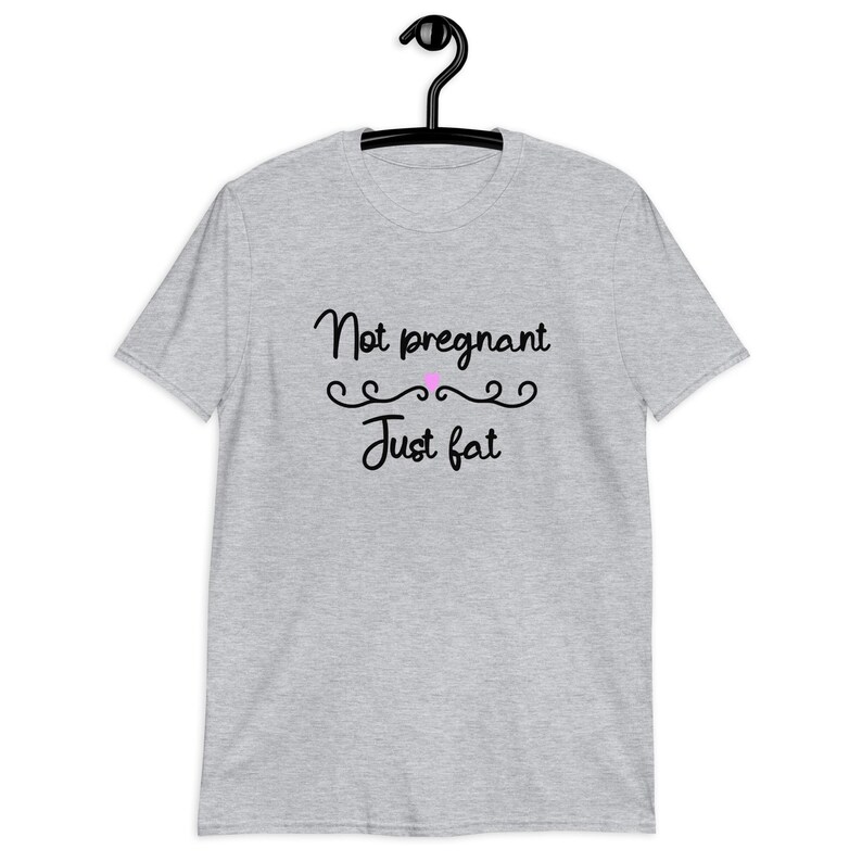 Sport grey t-shirt with the phrase Not pregnant just fat printed on the front with a small pink heart.