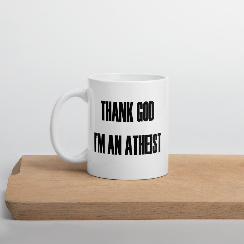 11 ounce white ceramic mug with the Thank God Im an Atheist printed on both sides.