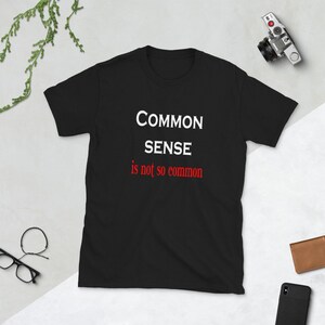 Common sense is not so common funny t-shirt. Short sleeve unisex common sense quote shirt. Black