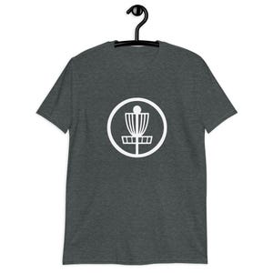 Dark heather grey t-shirt with an image of disc golf basket silhouette with a circle around it printed on the front.