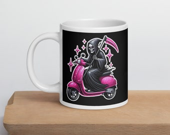 Grim reaper coffee mug. Death riding on a pink scooter glam reaper ceramic cup