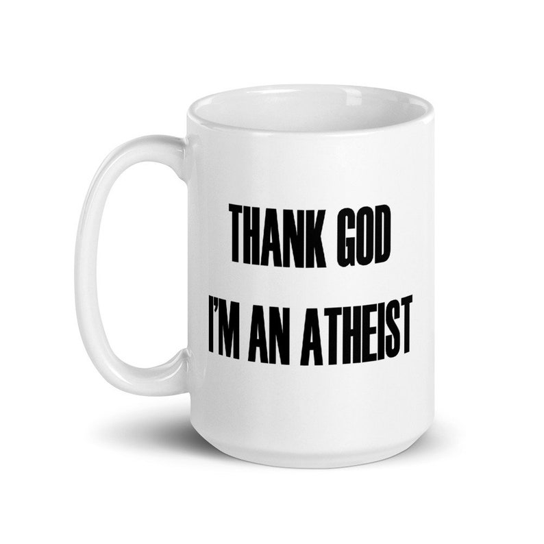 15 ounce white ceramic mug with the Thank God Im an Atheist printed on both sides.