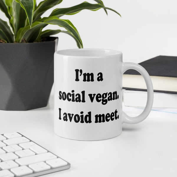 Funny vegan pun mug. I'm a social vegan. I avoid meet meat ceramic mug