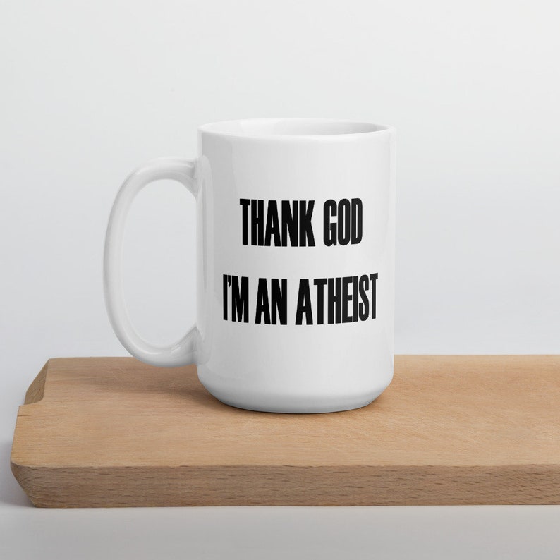 15 ounce white ceramic mug with the Thank God Im an Atheist printed on both sides.