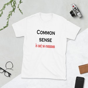Common sense is not so common funny t-shirt. Short sleeve unisex common sense quote shirt. White