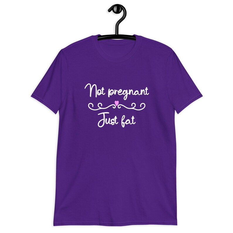 Purple t-shirt with the phrase Not pregnant just fat printed on the front with a small pink heart.
