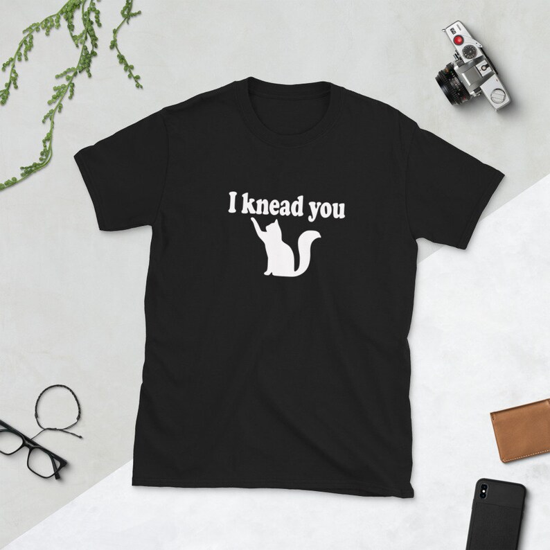 Cat pun T-shirt. I knead you kneading cat short sleeve graphic tee. Kitty biscuits animal pun shirt. Black