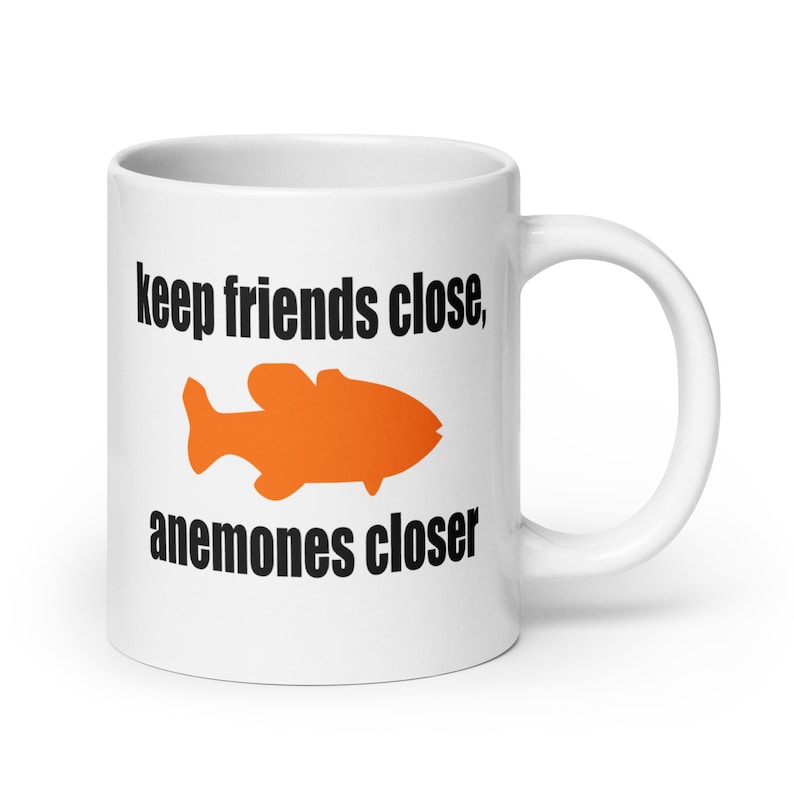 Sea anemone pun mug. Keep friends close, anemones closer. Friends and enemies funny pun dad joke mug. 20 Fluid ounces