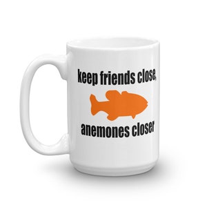 Sea anemone pun mug. Keep friends close, anemones closer. Friends and enemies funny pun dad joke mug. 15 Fluid ounces