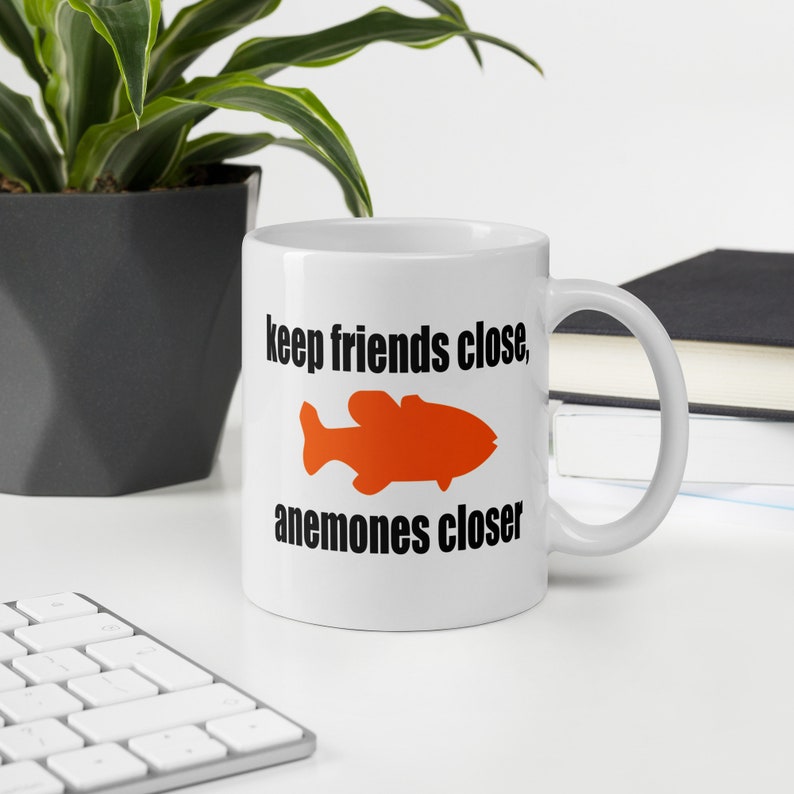 Sea anemone pun mug. Keep friends close, anemones closer. Friends and enemies funny pun dad joke mug. image 1