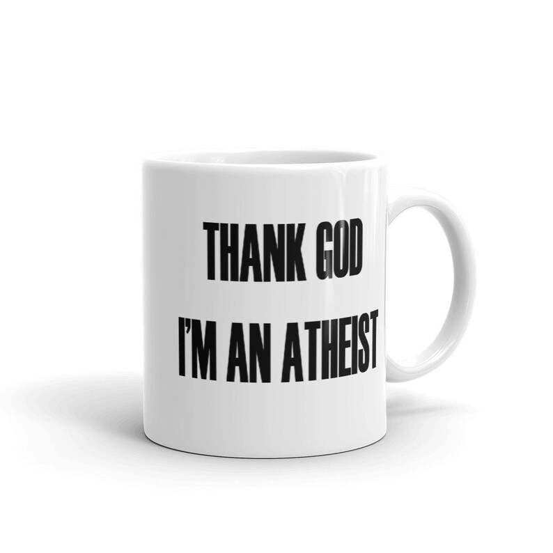 11 ounce white ceramic mug with the Thank God Im an Atheist printed on both sides.
