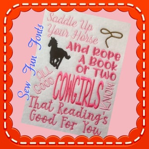 May include: Pink and black embroidery design with a horse, a lasso, and the text "Saddle Up Your Horse And Rope A Book Or Two All Good Cowgirls Know That Reading's Good For You".