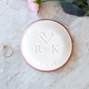 rose gold rim 3.5 inch gloss white ceramic wedding ring dish engraved with big heart, plus sign between 2 name initials, date