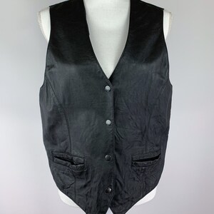 May include: A black leather waistcoat with a V-neck and button fastening. The waistcoat has two pockets on the front.