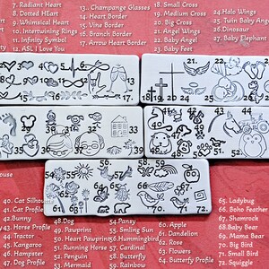 May include: A sheet of metal stamps with various designs, including hearts, animals, and symbols. The stamps are arranged in rows and numbered 1 through 72. The sheet is on a red background.