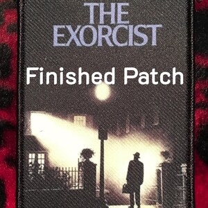 May include: Black rectangular patch featuring the movie title "THE EXORCIST" in light blue letters above a scene of a silhouetted figure on a street. The text "Finished Patch" is in white letters.
