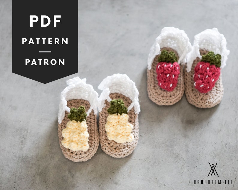 May include: PDF pattern for crocheting baby sandals with pineapple and strawberry designs. The sandals are beige with white crocheted straps and feature 3D fruit embellishments.