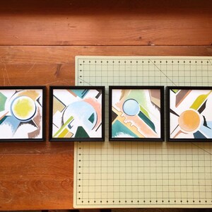 May include: Four framed abstract paintings with geometric shapes and muted colors, including yellow, green, blue, and brown.