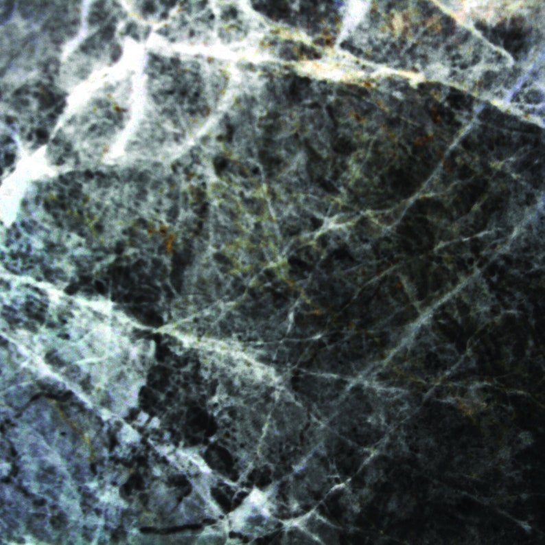 May include: A close-up of a dark grey marble surface with white and light grey veins. The marble has a rough, textured surface.