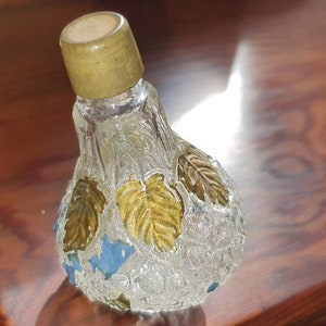 Very unusual Rare, embossed glass perfume bottle.