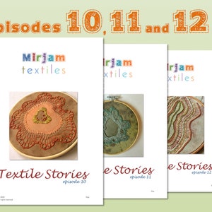 May include: Three embroidery hoop art pieces with the title "Textile Stories" and episode numbers 10, 11, and 12. The artwork features colorful embroidery designs on fabric.